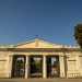 Camminiamo sin dove sulla destra si apre il viale che conduce allentrata in stile tempio greco del Cimitero Monumentale, ottocentesca area della necropoli che accoglie vere e proprie opere darte funerarie
